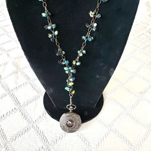 Necklace with watch.